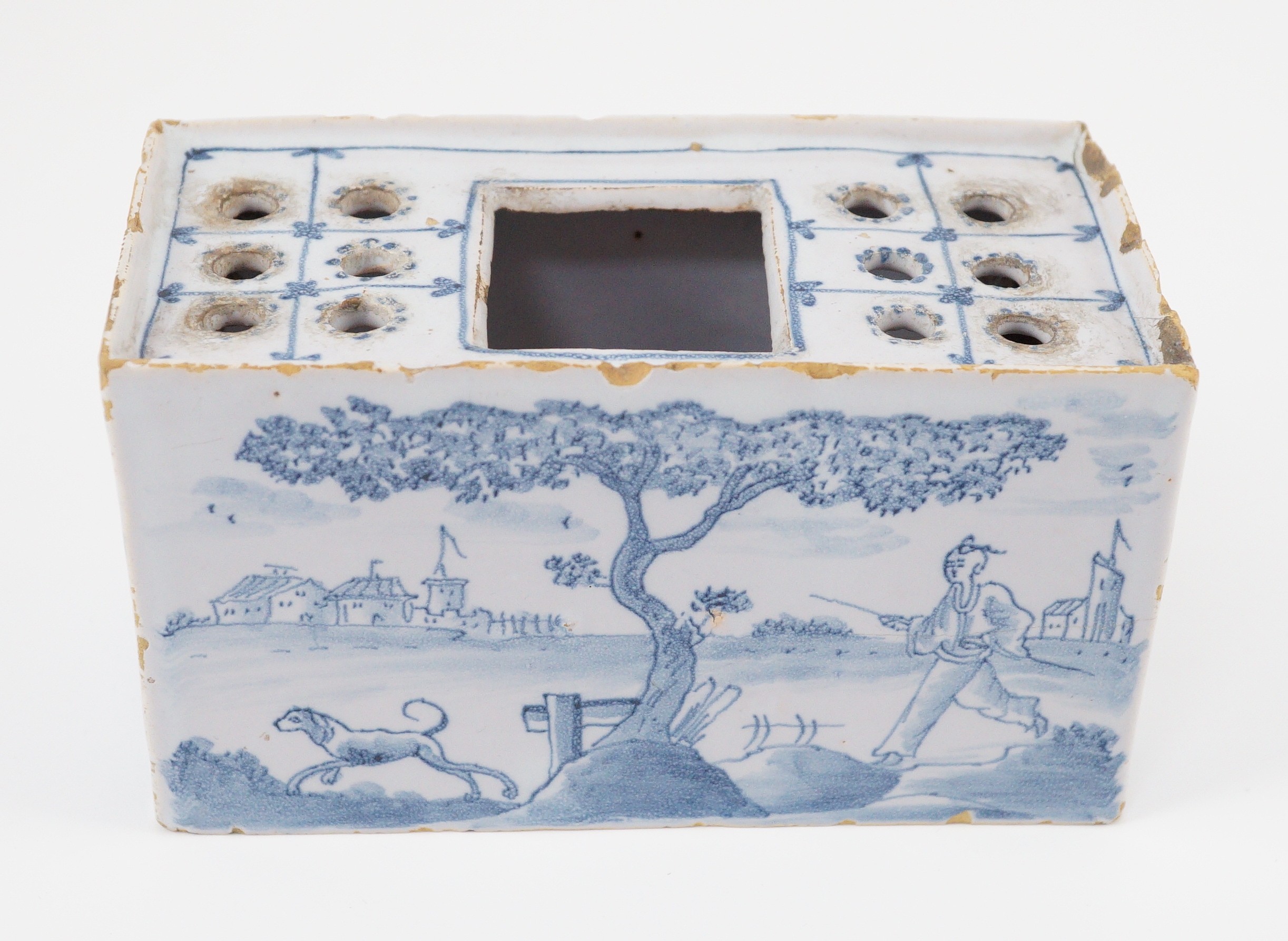 An English delftware flower brick, mid 18th century, 14.5cm wide, chips and crack
